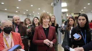 Senator Tina Smith talking to reporters on Capitol Hill