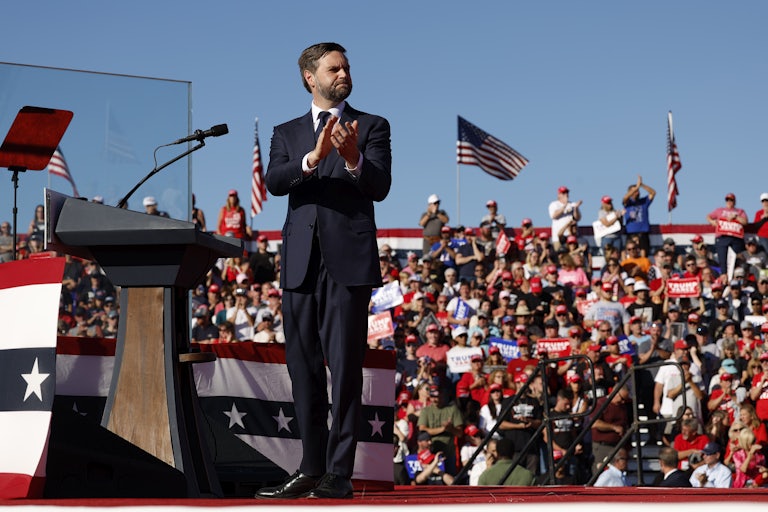 J.D. Vance claps at a campaign rally