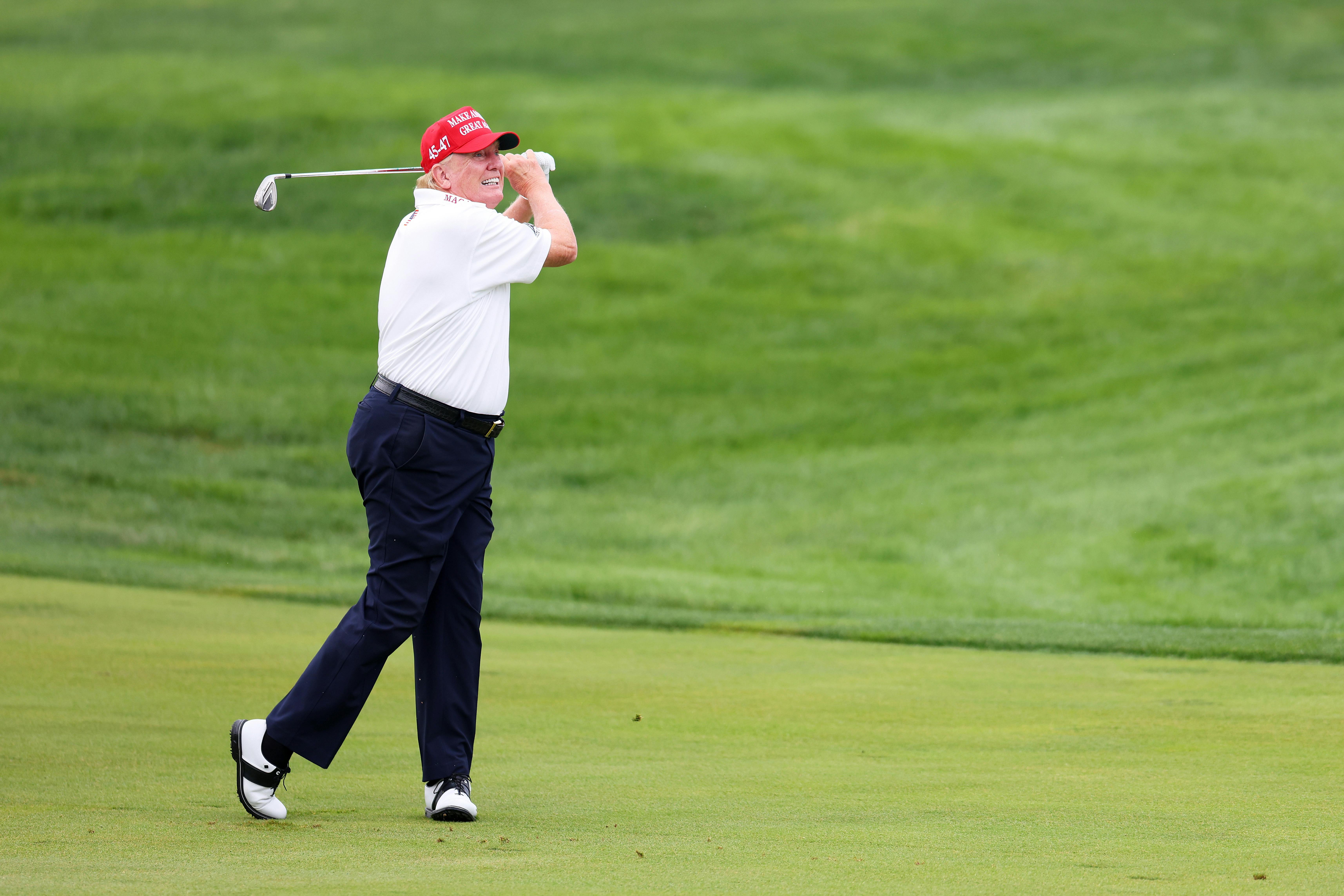 Trump takes a whack at the Trump National Golf Club