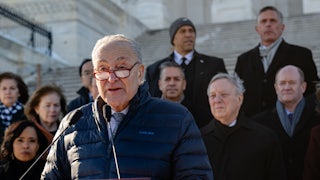 Senate Minority Leader Chuck Schumer speaks during a press conference at the Senate steps with a caucus of Democratic Senators before returning to the Senate chamber to vote on the Laken Riley Act.