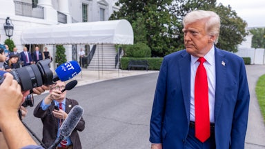 Donald Trump talks to the media before boarding Marine One on the South Lawn of the White House.