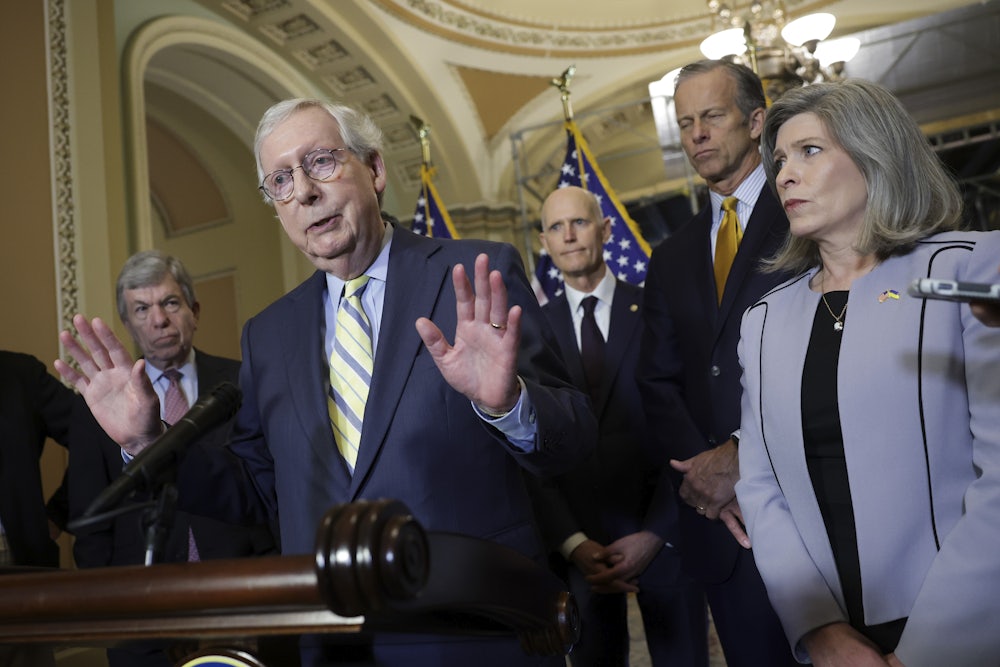 Senate Minority Leader Mitch McConnell speaks to reporters.