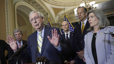 Senate Minority Leader Mitch McConnell speaks to reporters.