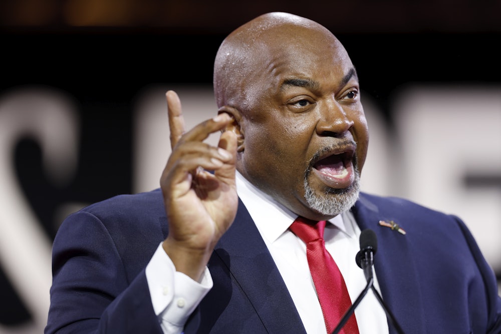 Mark Robinson speaks with finger raised in the air