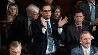 George Santos stands up and claps