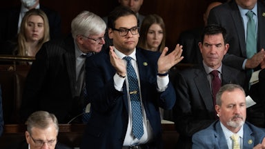 George Santos stands up and claps