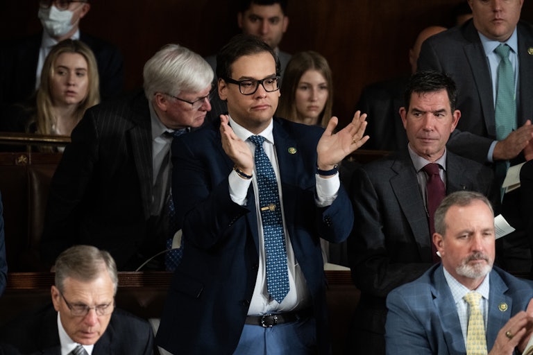 George Santos stands up and claps