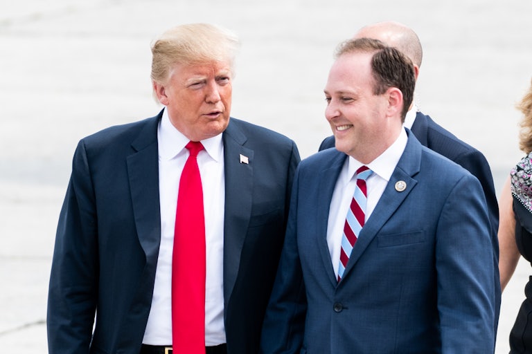 Donald Trump speaks with Lee Zeldin as he smiles