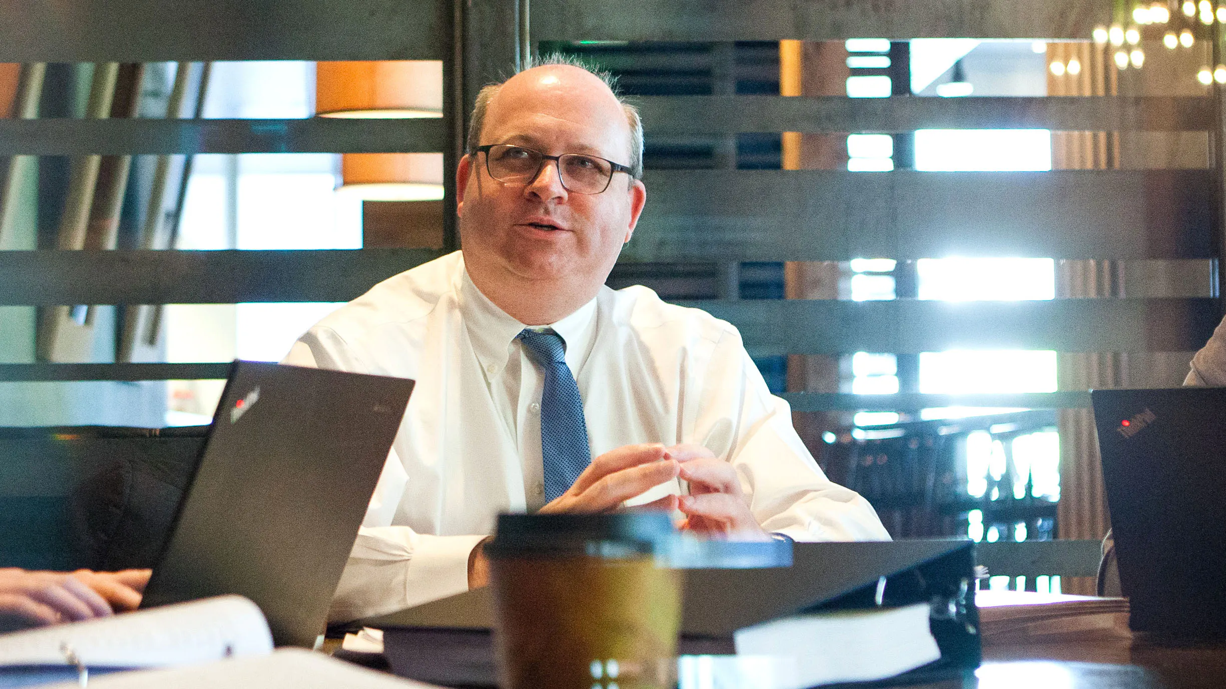 Mark Elias photographed talking while seated in an office 