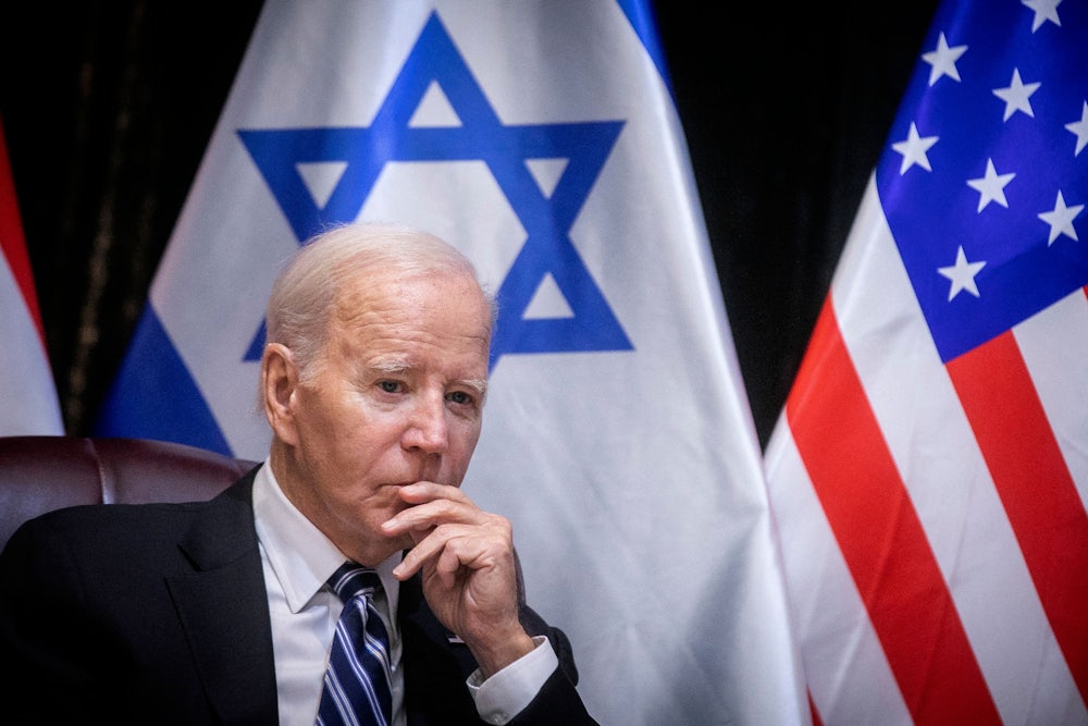 Joe Biden puts his hand to his mouth during an appearance in Israel shortly after Hamas's October 7 attack.