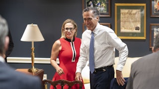 Kyrsten Sinema and Mitt Romney at a meeting in June