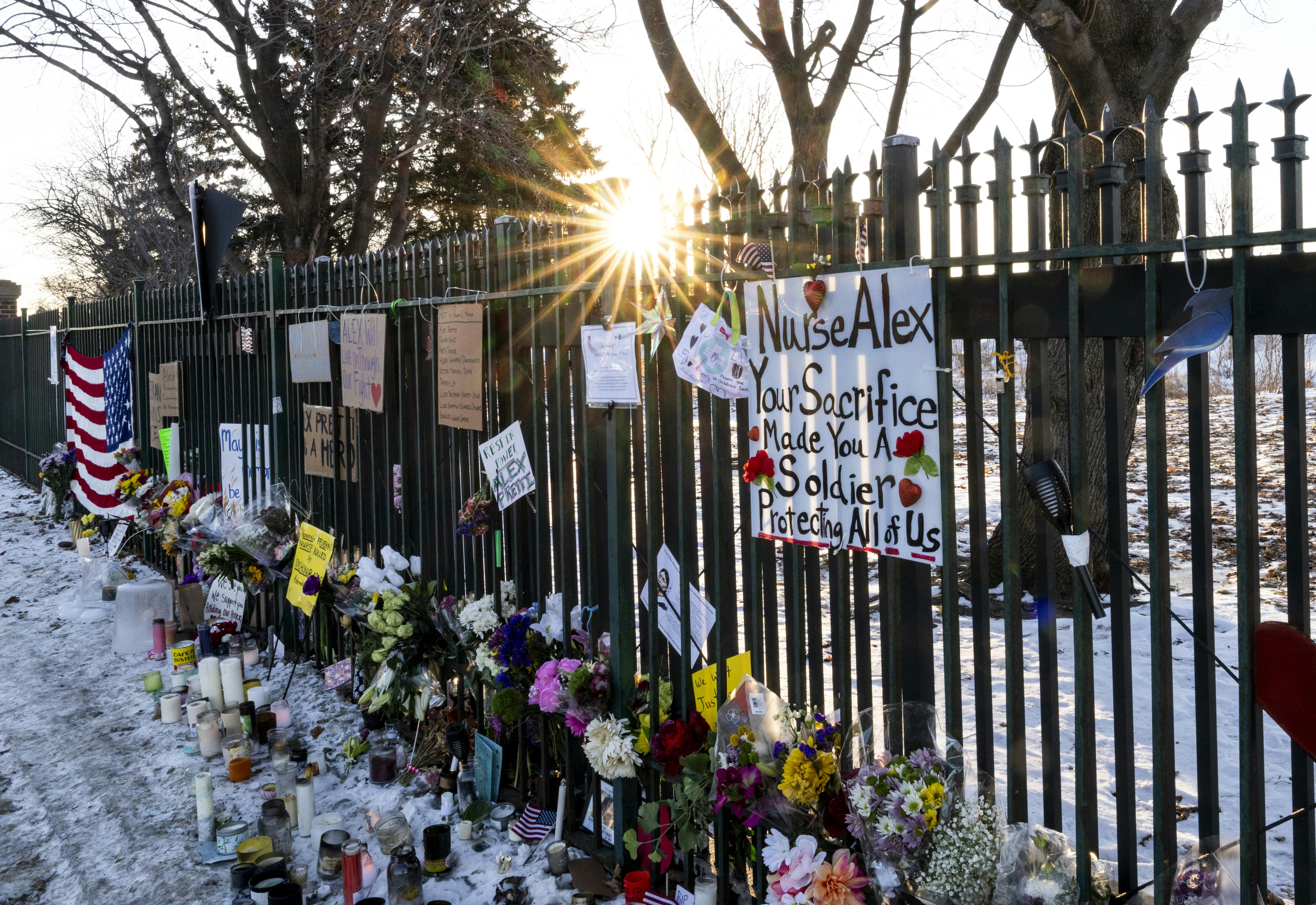 A memorial for Alex Pretti along the fence outside the VA hospital in Minneapolis, Minnesota