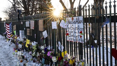 A memorial for Alex Pretti along the fence outside the VA hospital in Minneapolis, Minnesota