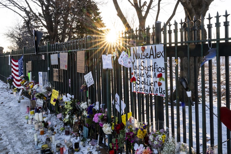 A memorial for Alex Pretti along the fence outside the VA hospital in Minneapolis, Minnesota