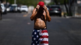 Shirtless man overheating