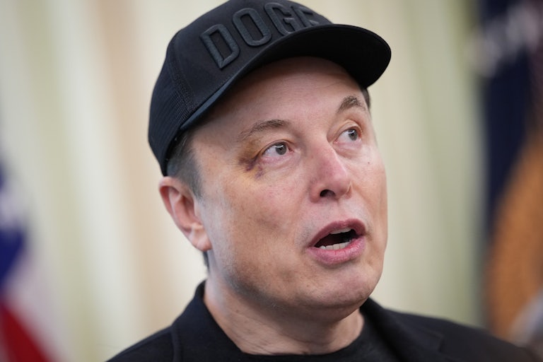 Elon Musk speaking and raising his eyebrows