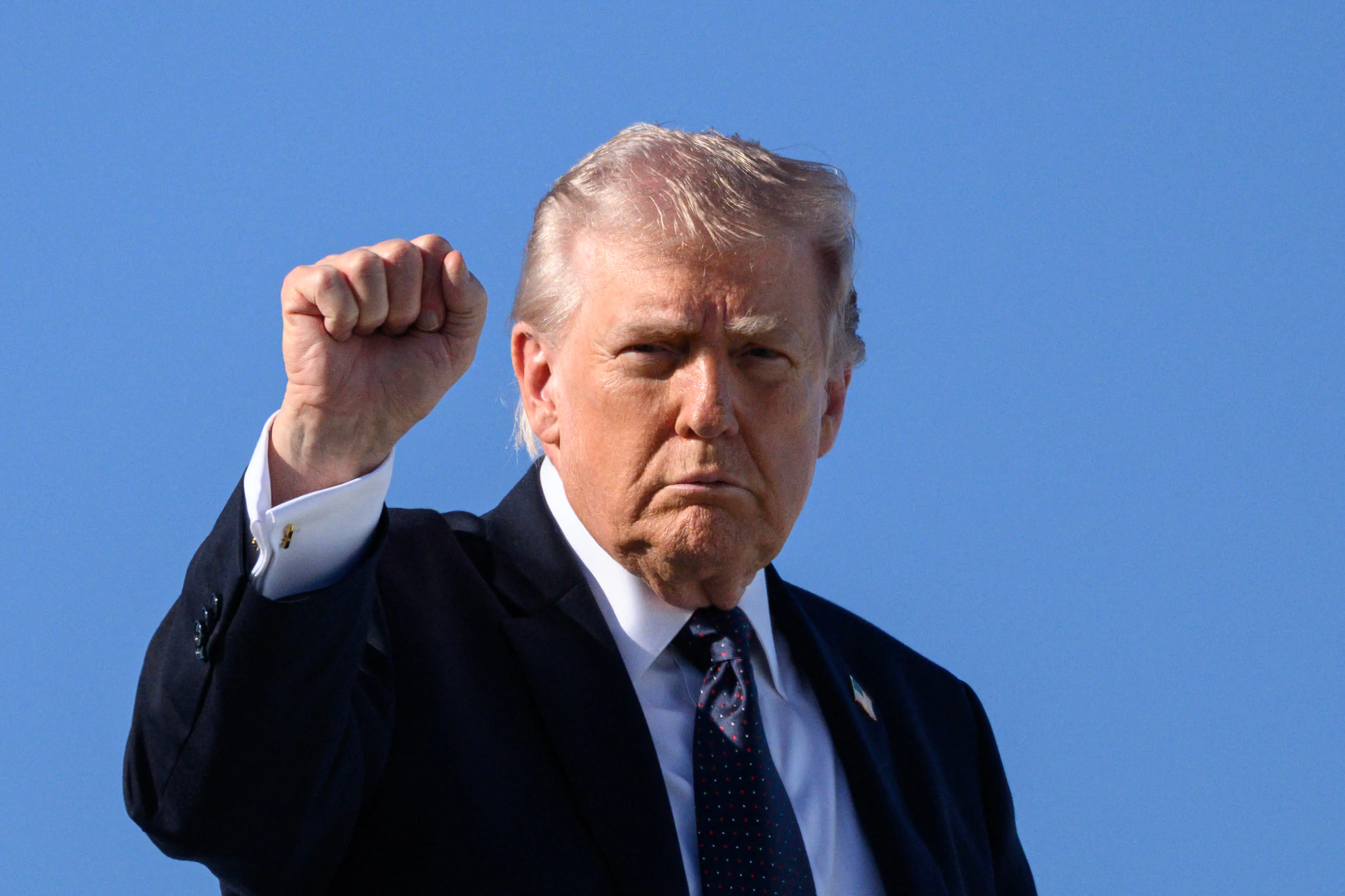 Trump holds up a fist
