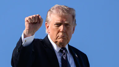 Trump holds up a fist