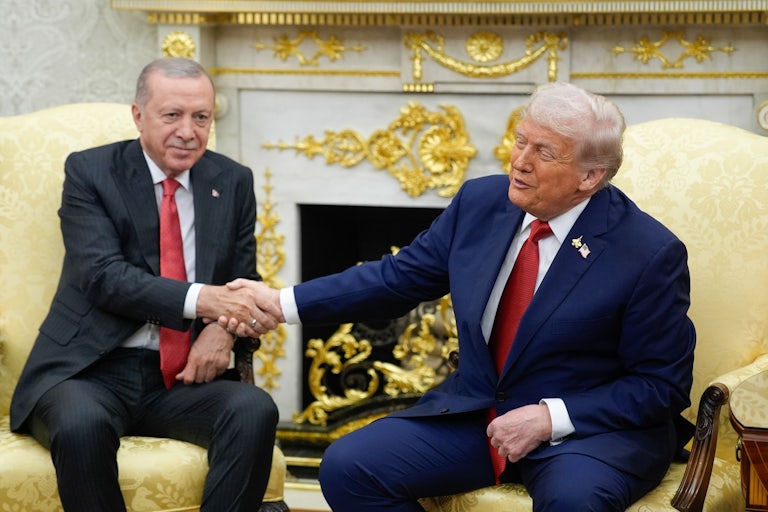 Donald Trump and Turkish President Recep Tayyip Erdoğan shake hands in the Oval Office of the White House.