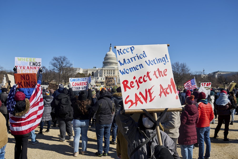 People participate in a protest against the Trump administration's mass firing of government workers and civil servants in front of the Capitol building in Washington D.C. on Presidents' Day, Feb. 17, 2025.