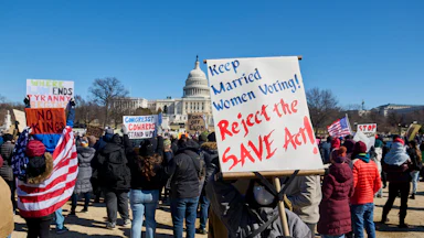 People participate in a protest against the Trump administration's mass firing of government workers and civil servants in front of the Capitol building in Washington D.C. on Presidents' Day, Feb. 17, 2025.