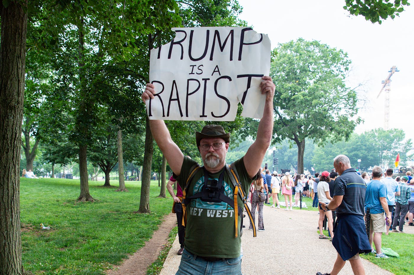 A protester from Coral Gables, Florida, holds a sign amongst the crowd during the U.S. Army’s 250th Anniversary Parade in Washington, D.C., 
