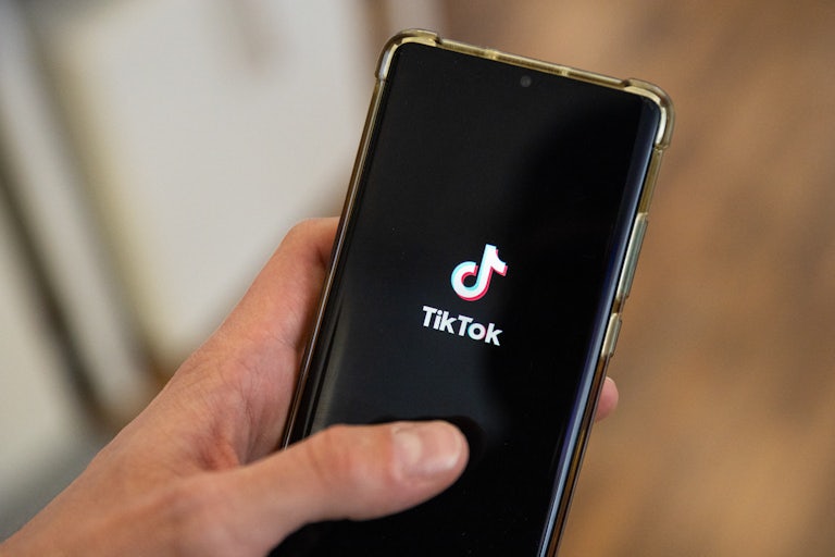 The TikTok app opens on a phone