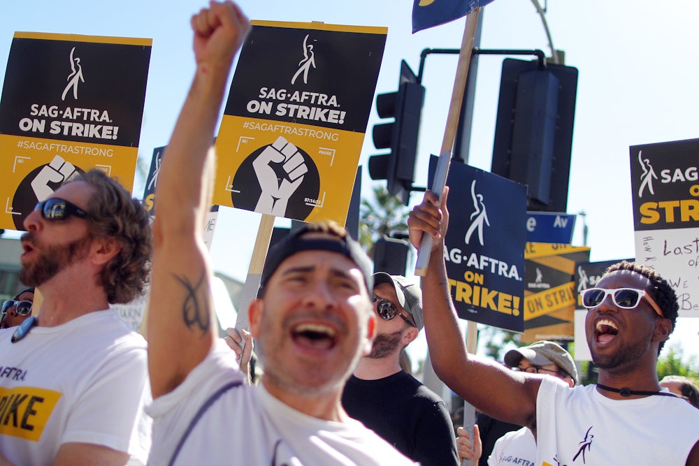 SAG-AFTRA members and supporters chant outside Paramount Studios on day 118 of their strike against the Hollywood studios on November 8, 2023 in Los Angeles, California.