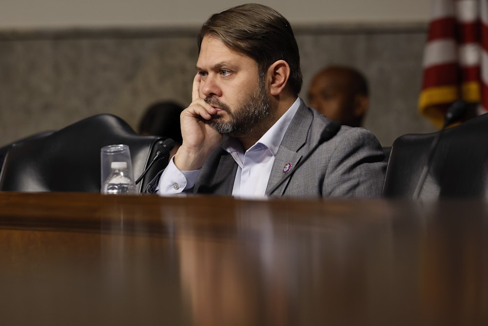 Arizona Representative Ruben Gallego listens during a hearing.
