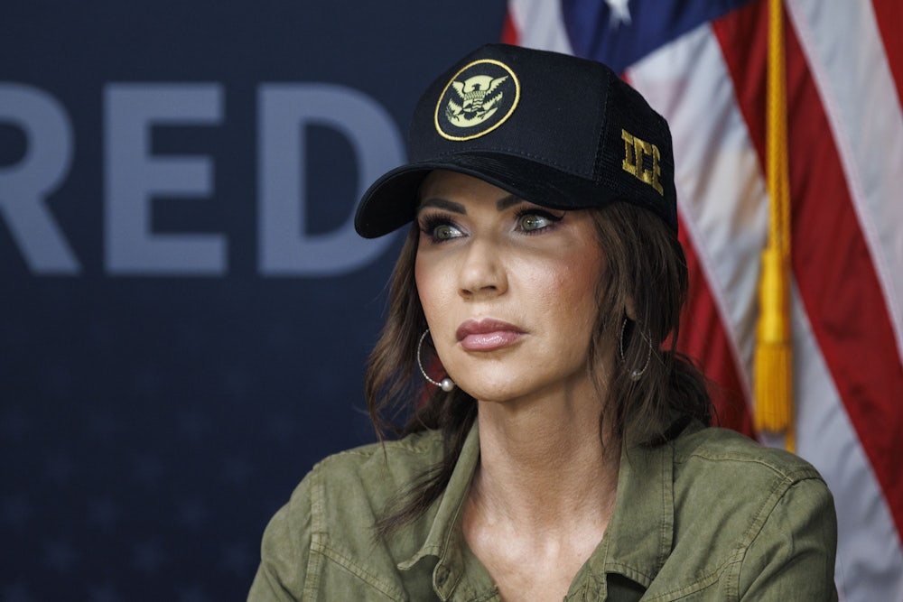 Homeland Security Secretary Kristi Noem wearing an ICE hat