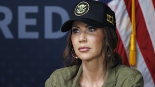 Homeland Security Secretary Kristi Noem wearing an ICE hat
