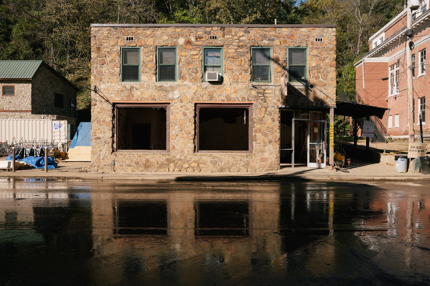 A photograph of floodwaters from the French Broad River (which flows north) inundating roads and buildings in Marshall, downstream from Asheville.