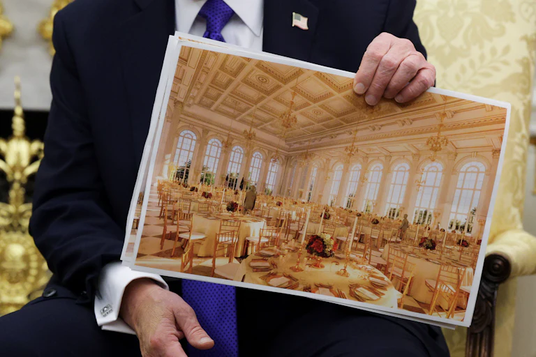 President Trump holding a rendering of the White House ballroom
