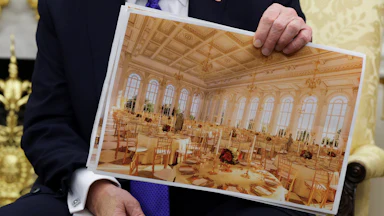 President Trump holding a rendering of the White House ballroom