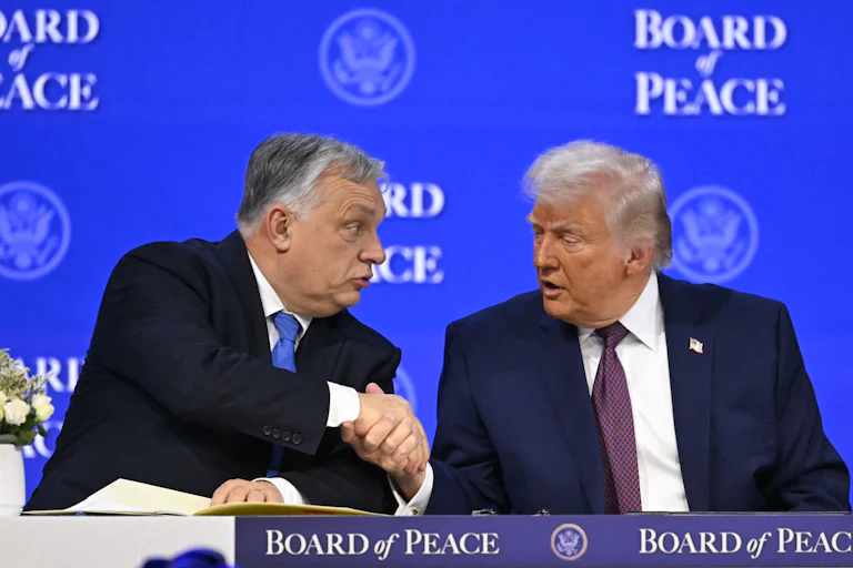Hungary’s Prime Minister Viktor Orbán shakes hands with Donald Trump at the “Board of Peace” meeting during the World Economic Forum annual meeting in Davos.