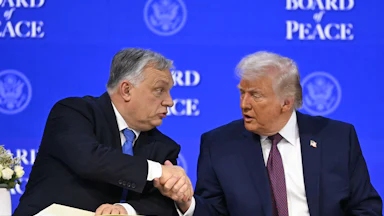 Hungary’s Prime Minister Viktor Orbán shakes hands with Donald Trump at the “Board of Peace” meeting during the World Economic Forum annual meeting in Davos.