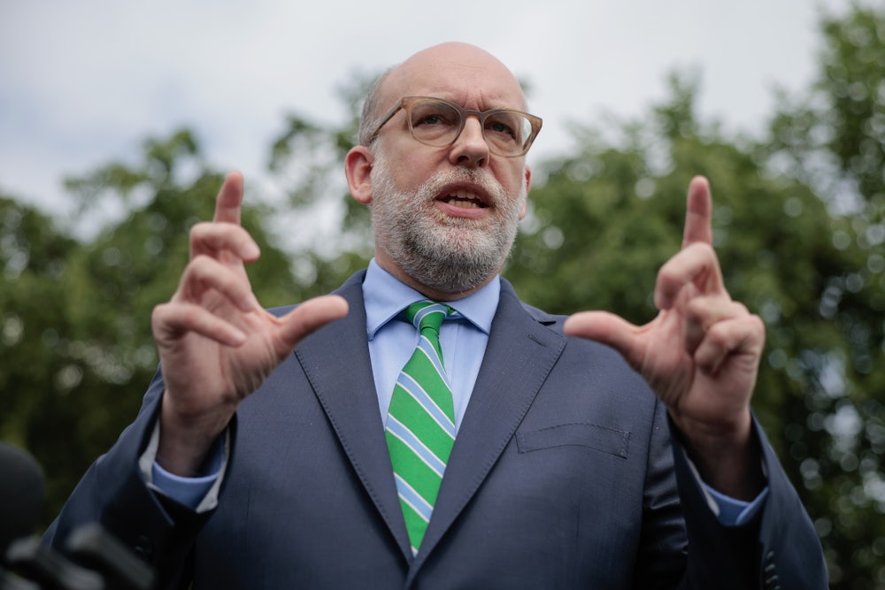 Office of Management and Budget Director Russell Vought talks to reporters outside the West Wing of the White House.