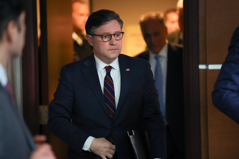 Mike Johnson walks in the Capitol