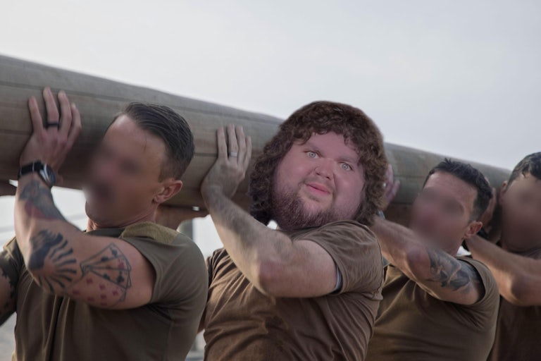 JD Vance meme head posted on his body as he trains with three other Navy Seals, all holding up a giant log.