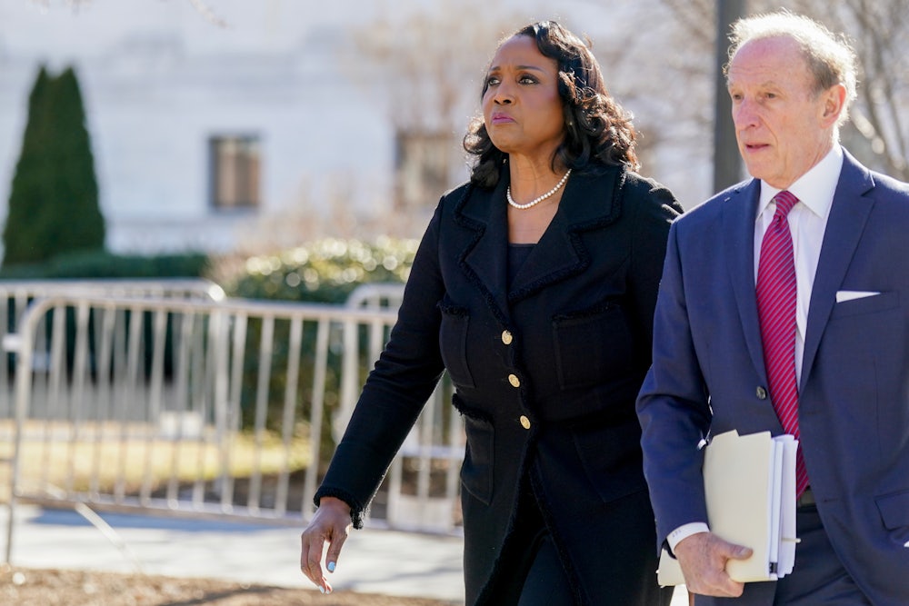 Lisa Cook, governor of the U.S. Federal Reserve and her attorney Abbe Lowell outside the U.S. Supreme Court.