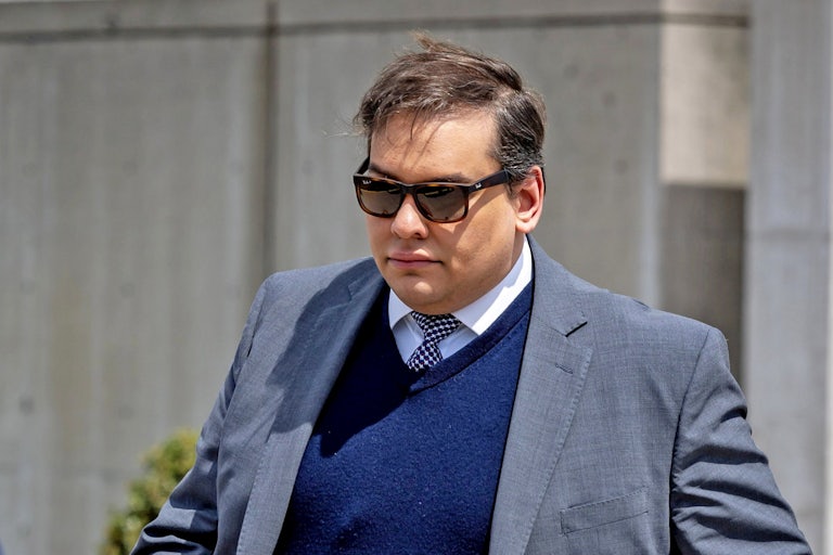 George Santos walks out of a courthouse in New York