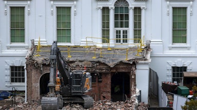 An excavator sits on the rubble after the East Wing of the White House was demolished.
