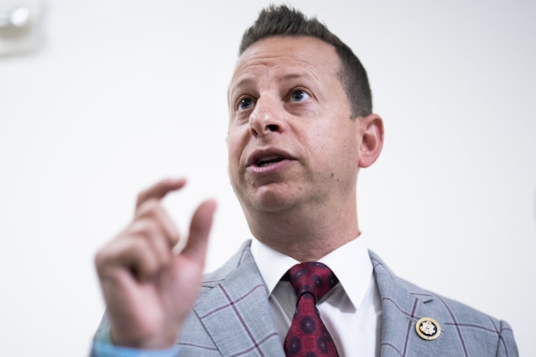 Jared Moskowitz speaks while holding up his fingers