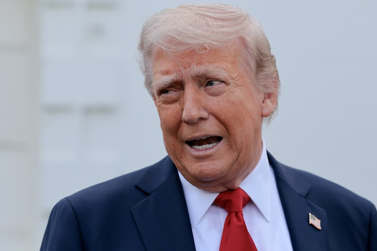 Donald Trump looks to the side and speaks