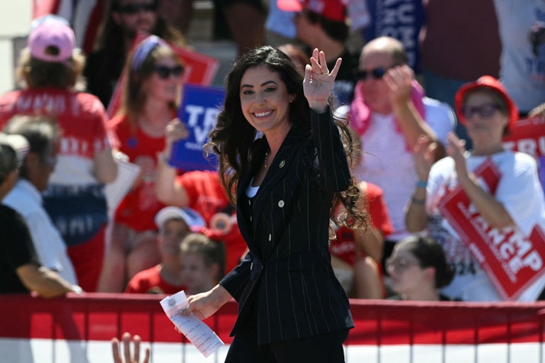 Representative Anna Paulina Luna waves while on stage at a Donald Trump rally