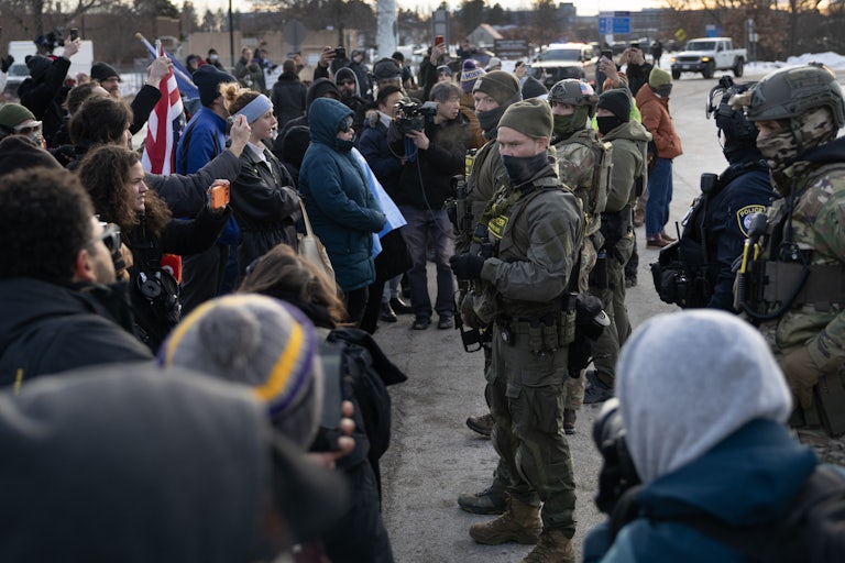 Protesters face off with masked federal agents in Minneapolis, Minnesota