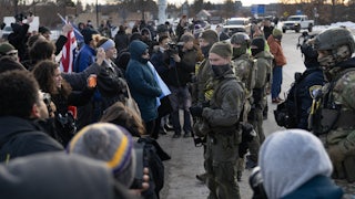 Protesters face off with masked federal agents in Minneapolis, Minnesota