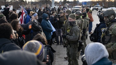 Protesters face off with masked federal agents in Minneapolis, Minnesota
