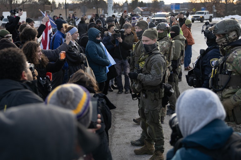 Protesters face off with masked federal agents in Minneapolis, Minnesota