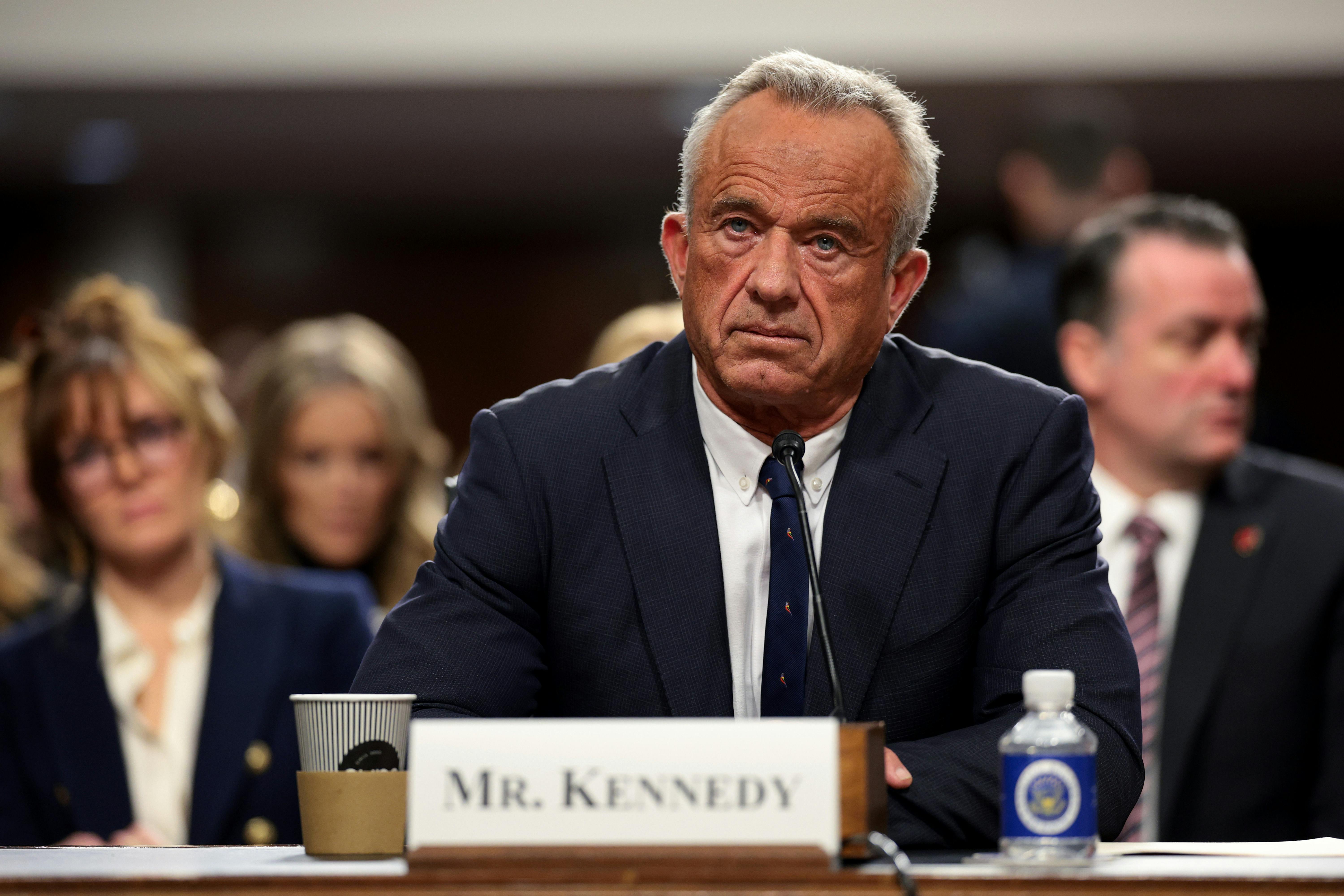 Robert F. Kennedy Jr stares forward as he sits in the Capitol for hearings over his nomination to lead the Department of Health and Human Services 